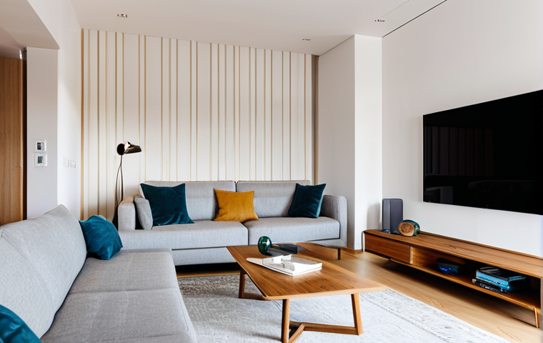 Smart Home Interior**

"Bright, modern apartment interior in Lisbon, Portugal. Fully clothed woman uses a tablet to control smart home features. Open plan living room with minimalist furniture, warm lighting.  Smart lighting control panel visible.  Safe for work, appropriate content, fully clothed, professional, perfect anatomy, natural proportions, high quality, family-friendly."

**